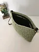 shell-stitch-model-suni-deri-astarli-kagit-ip-clutch-canta-yesil
